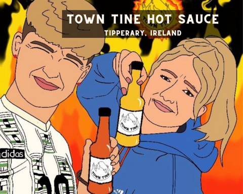 Picture of Town Tine Hot Sauce Owners Holding Up Hot Sauce