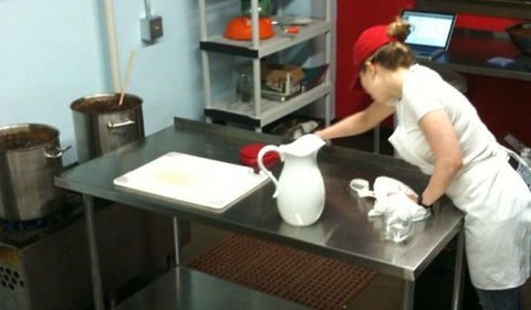 Quince and Apple co-founder Clare Stoner Fehsenfeld cleans up after a production in our first kitchen