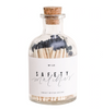 Black safety matches in a clear apothecary style bottle. 
