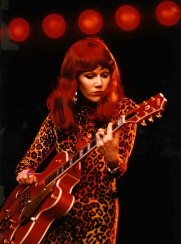 Poison Ivy of The Cramps in leopard.