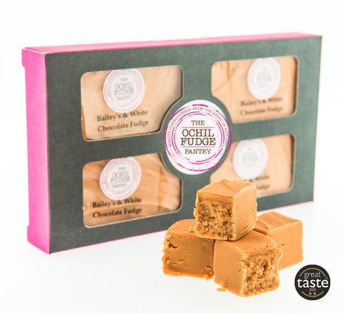 The Ochil Fudge Pantry's fudge selection box containing 4 x Baileys and White Chocolate Fudge with a stack of Great Taste 2015 Award Winning Heather Honey Fudge