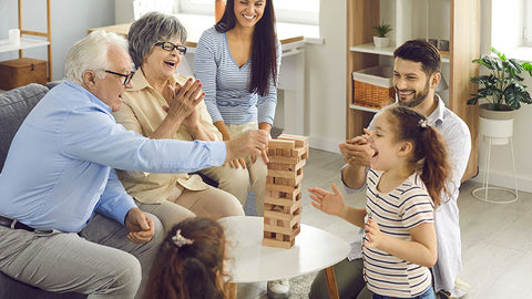 Three generation family playing Jenga at home