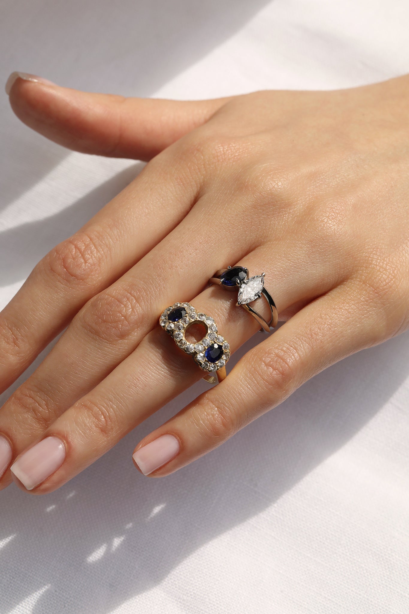 A remodelled sapphire engagement ring, handmade in England using a family heirloom sapphire ring. The style is a Toi et Moi engagement ring made using the sapphire from the original ring with an additional diamond added to make the finished Toi et Moi engagement ring
