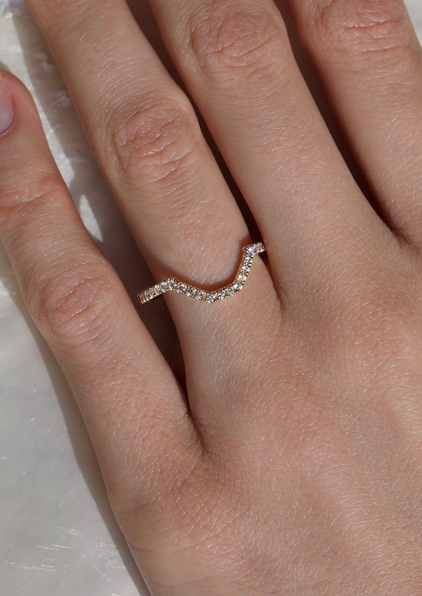 Bespoke diamond eternity ring customised to fit the shape of our client's antique engagement ring