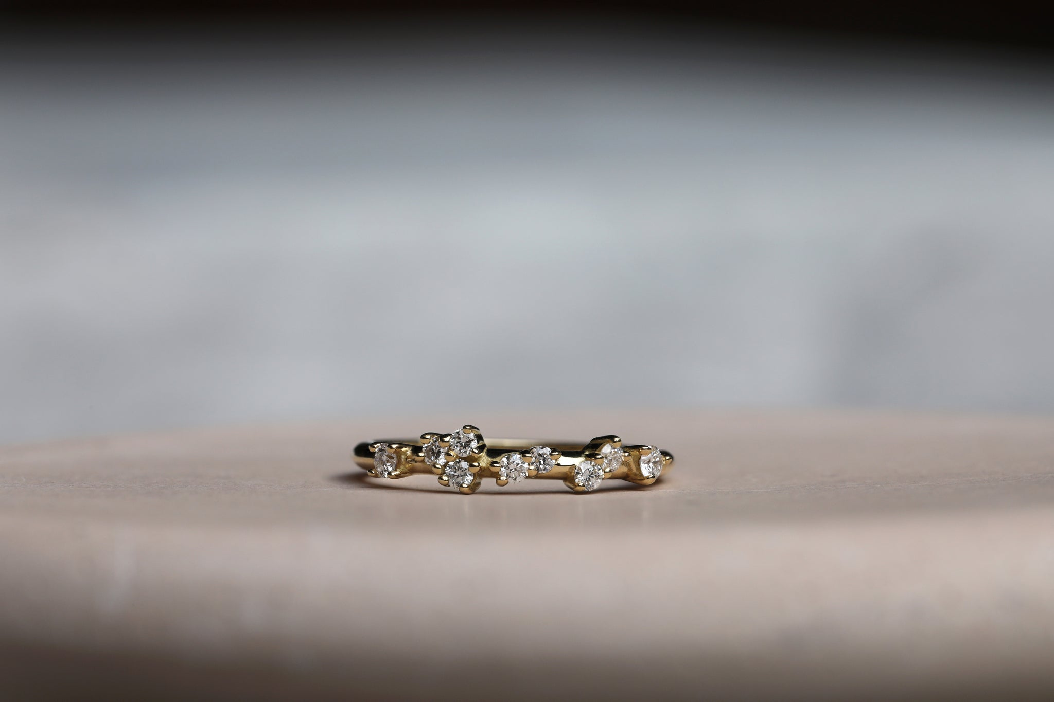 Bespoke diamond wedding ring handmade in London using a delicate mix of round diamonds