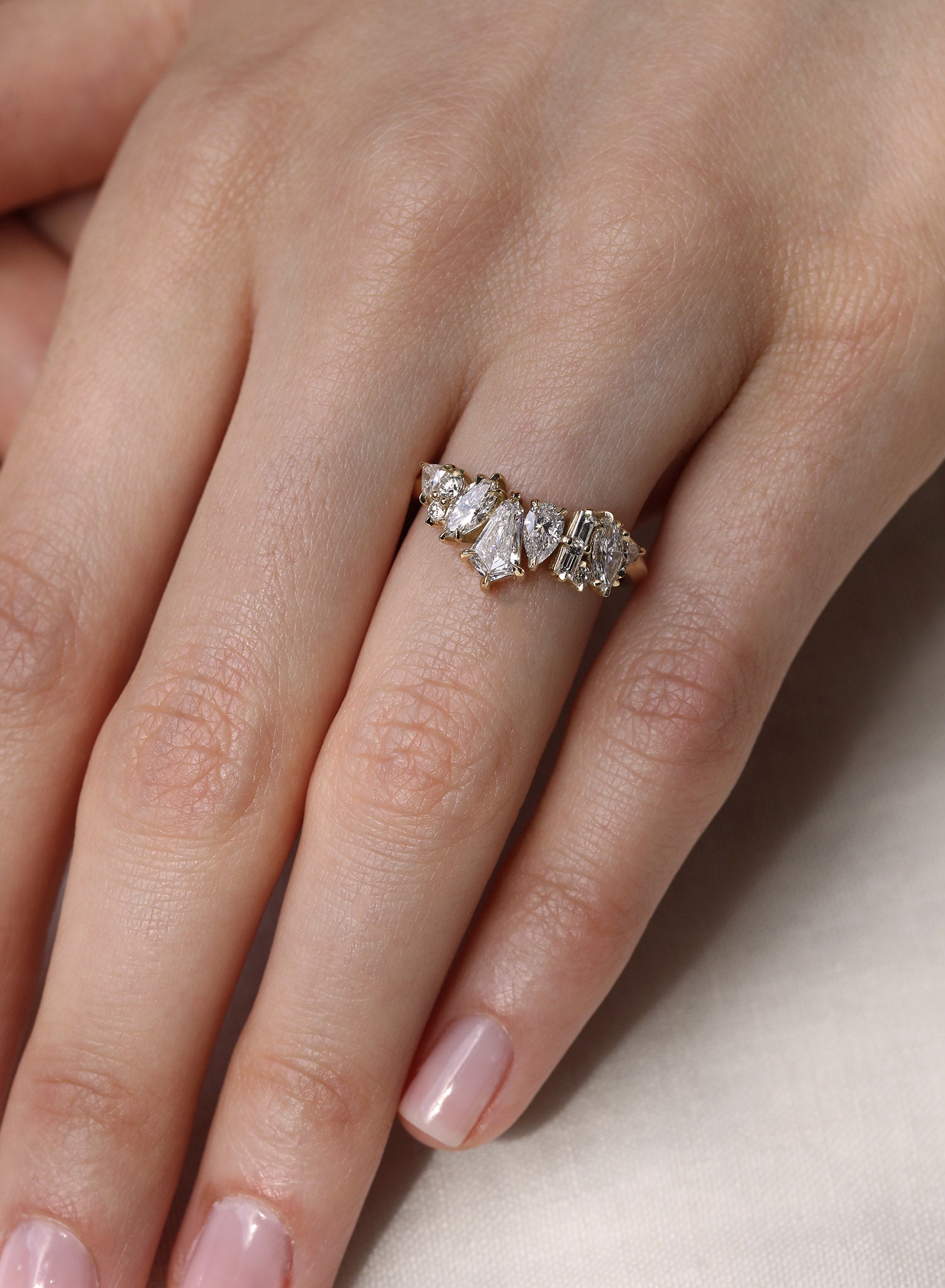 Bespoke diamond wedding ring featuring a playful yet refined assortment of diamond cuts.
