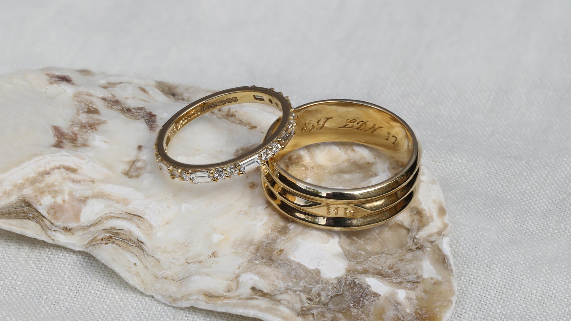 Two made-to-order wedding rings customised with hand engraving inside each band.