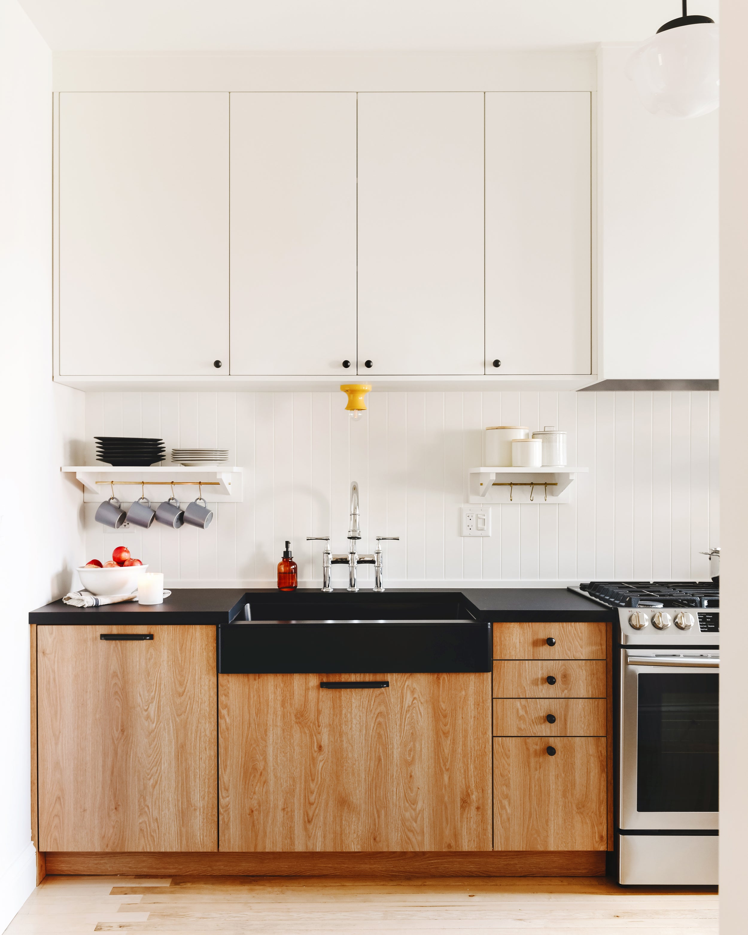 Yellow light fixture over sink.