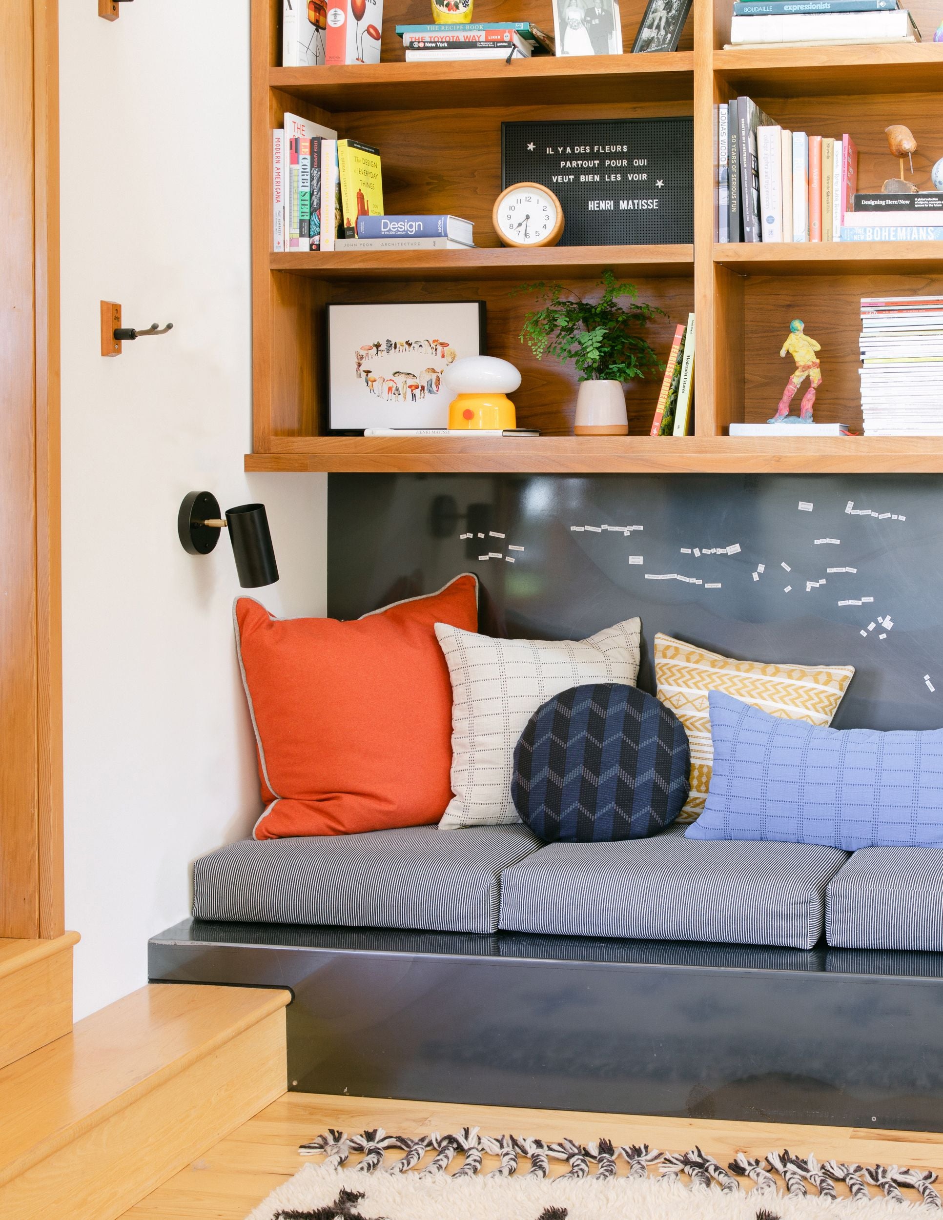 couch with pillows and a shelf