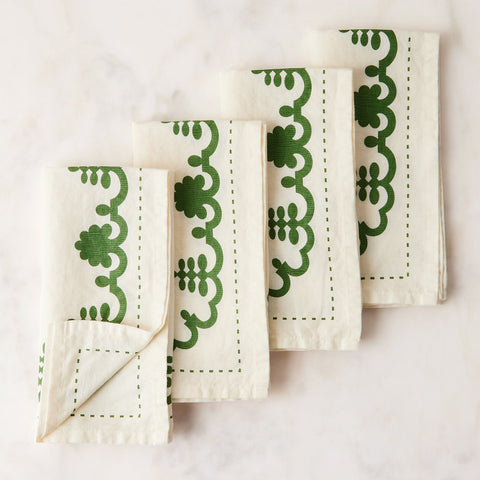 https://cdn.shopify.com/s/files/1/1159/3118/files/1012-1011_food52_mergentime-garland-napkins-set-of-4_white-w-green_silo_1x1_ty-mecham_large.jpg?v=1698707889