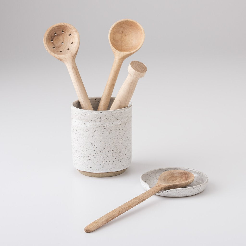 group of wooden spoons in a cup