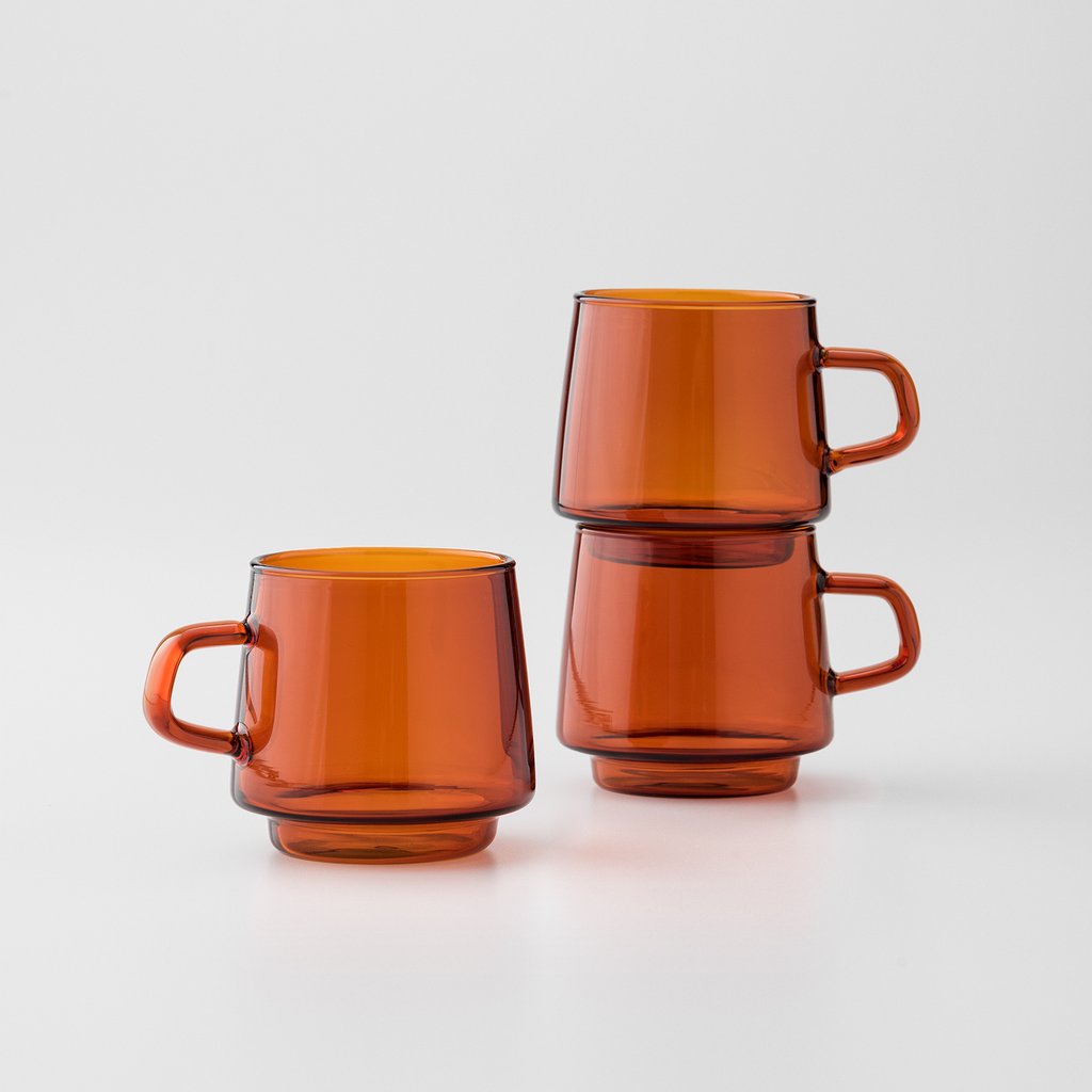three brown glass mugs