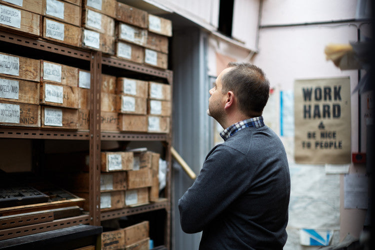 man looking at a items on a shelf