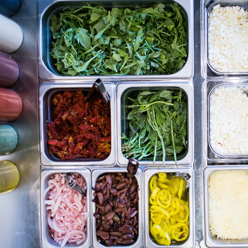 group of containers with food in it