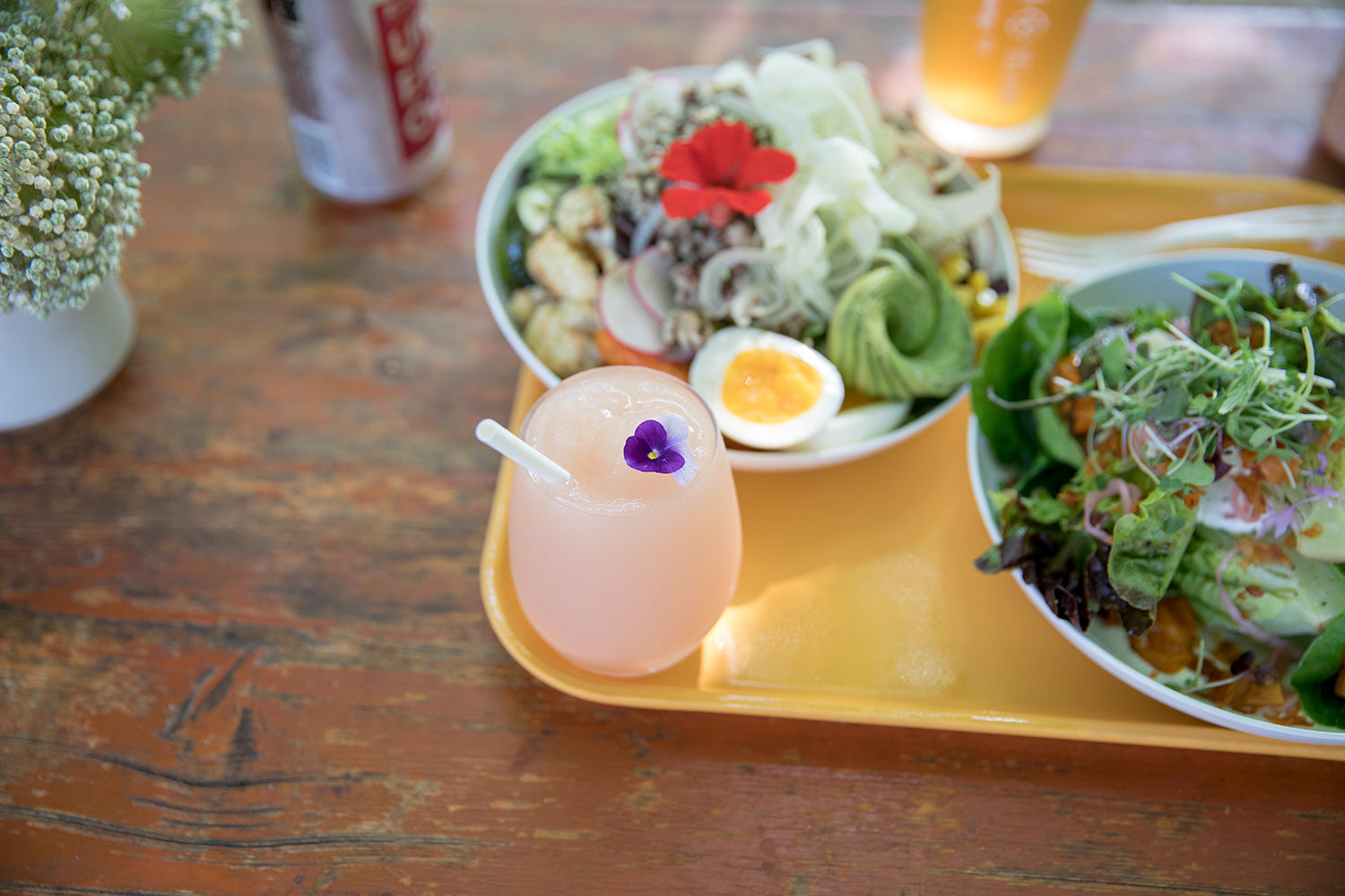 plates of salad and a drink