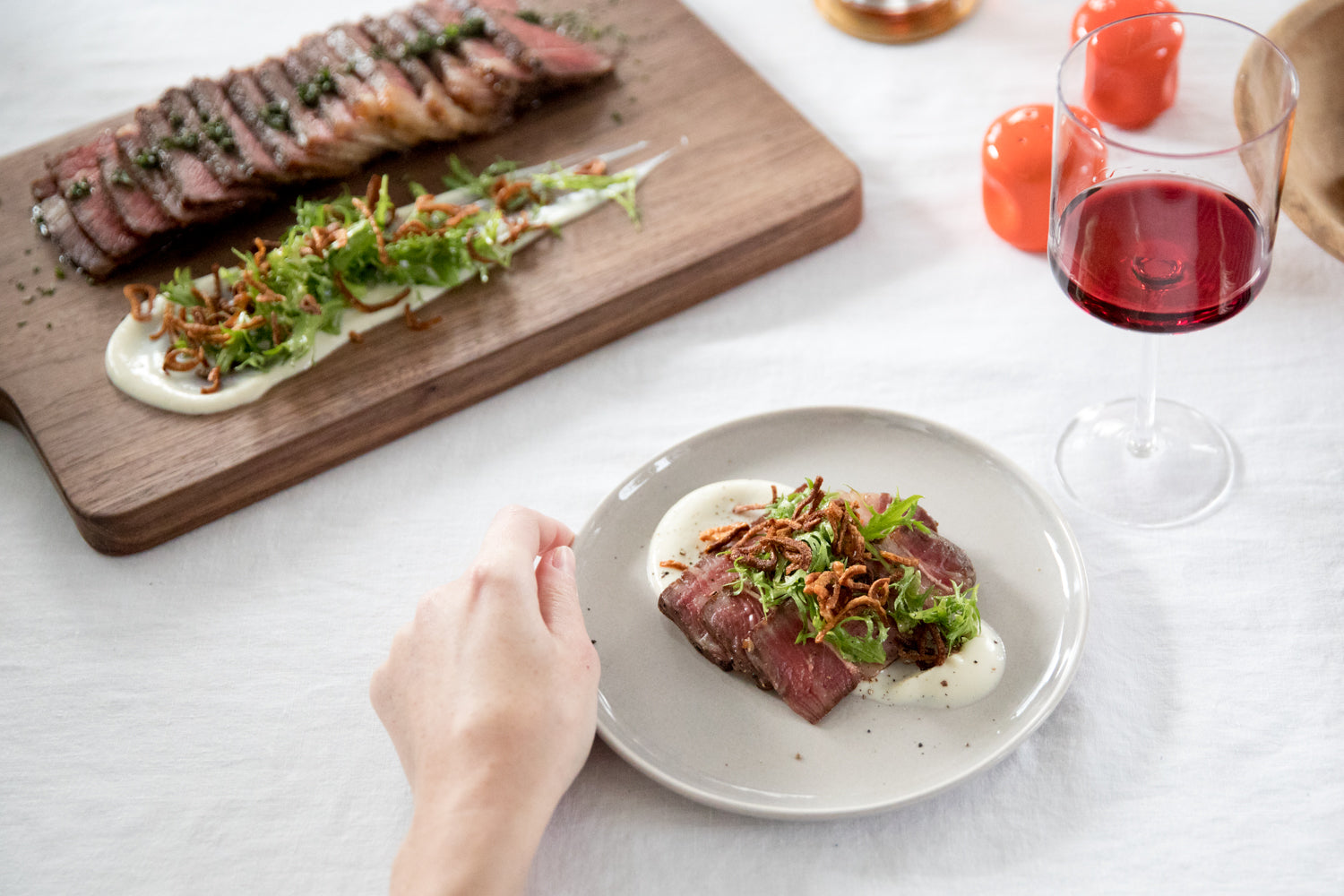 plate of food and a glass of wine