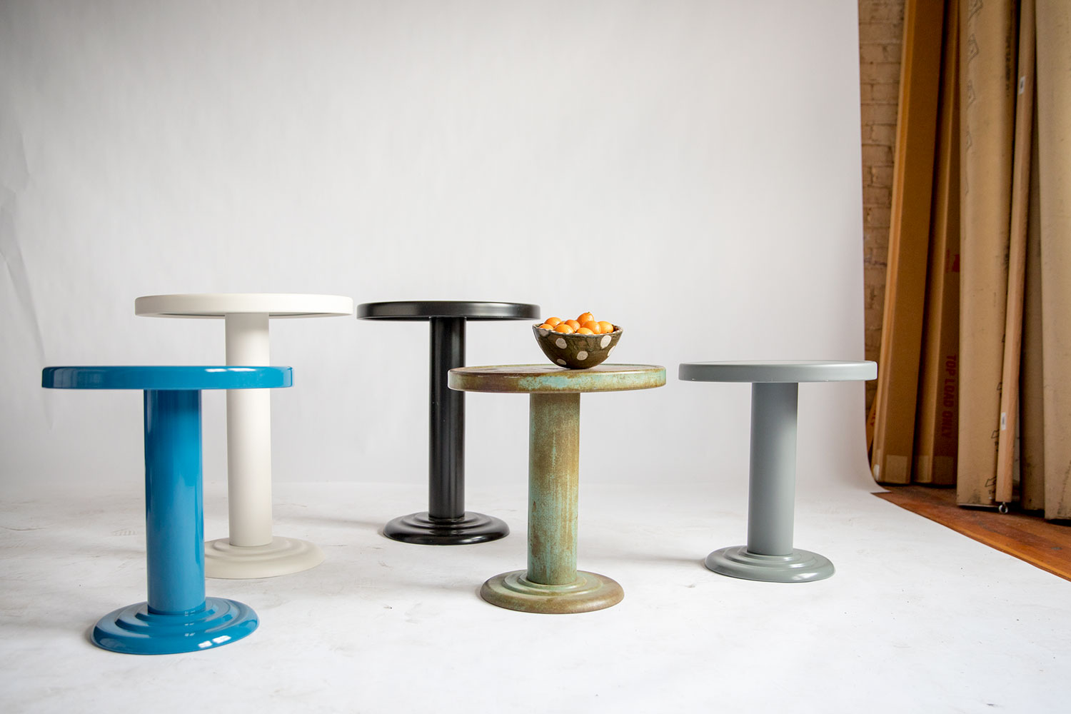 group of round tables with objects on them