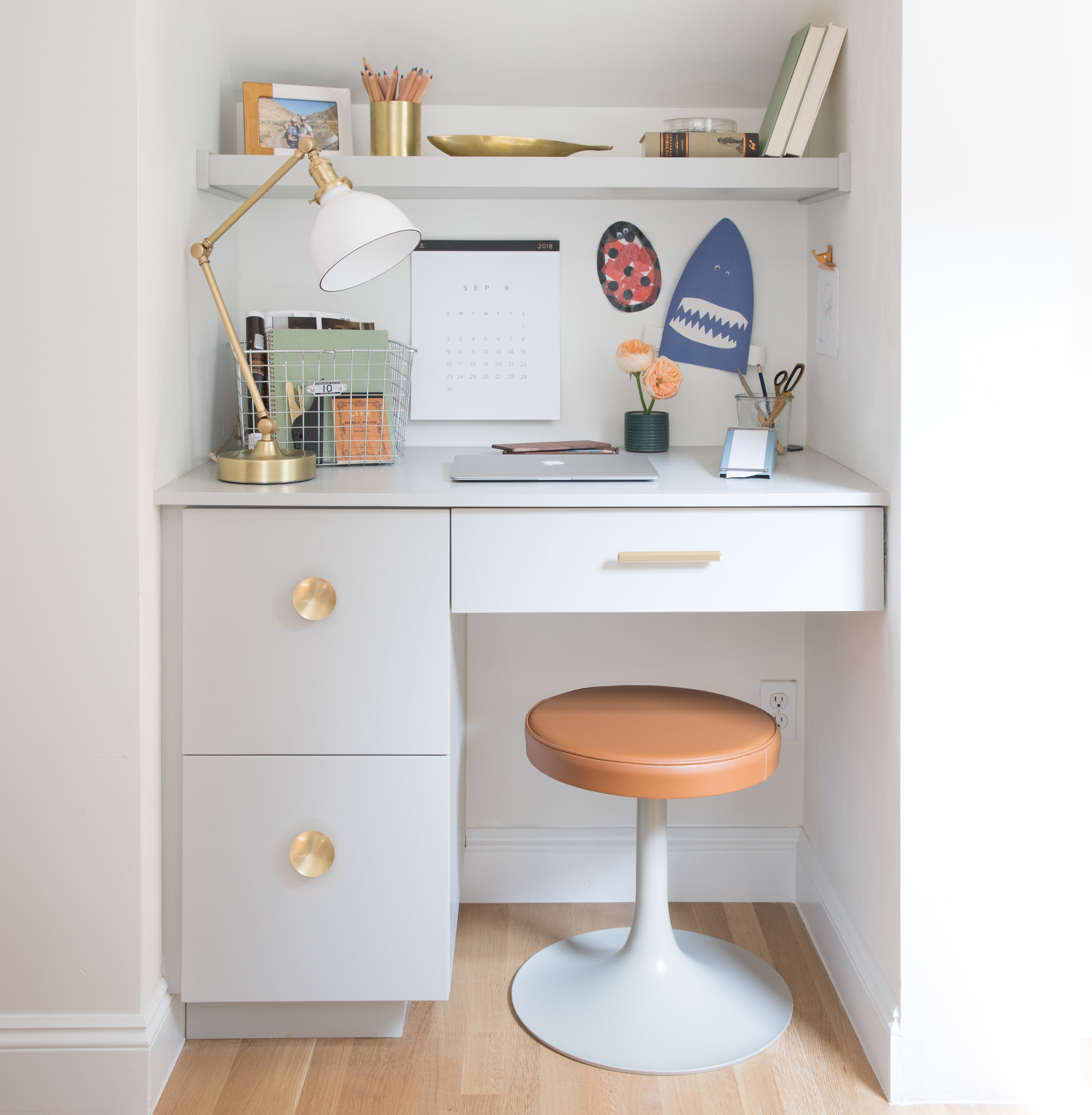 desk with round desk chair and lamp