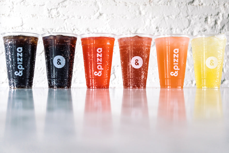 row of colorful drinks in plastic cups
