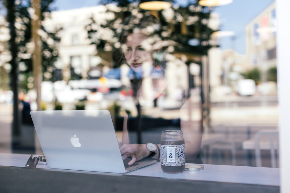 woman on her laptop in a coffee shop