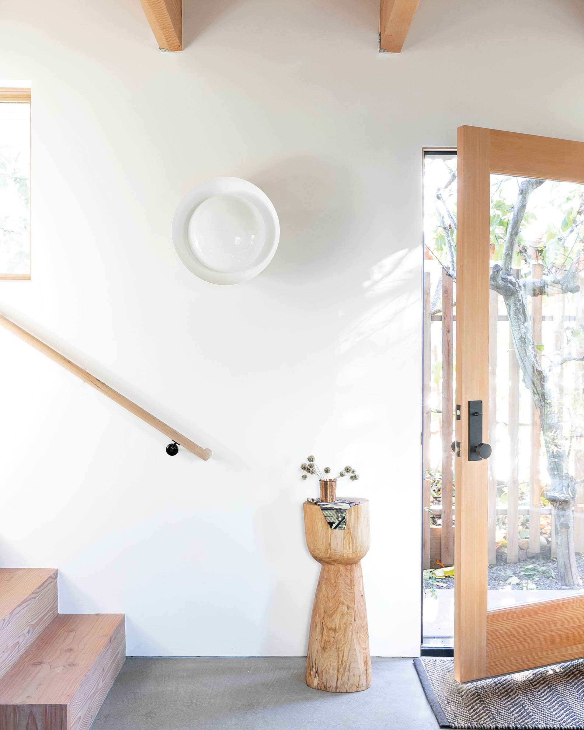 A Ray wall sconce in an entryway. 