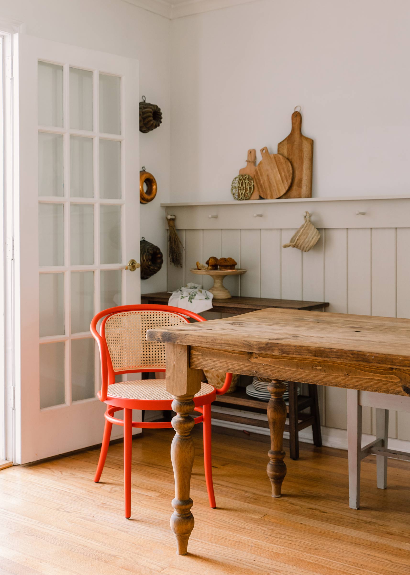 The TON Bentwood chair in red in a dining room. 