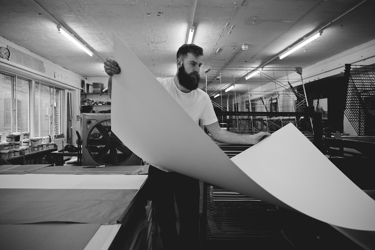 person holding a large piece of paper