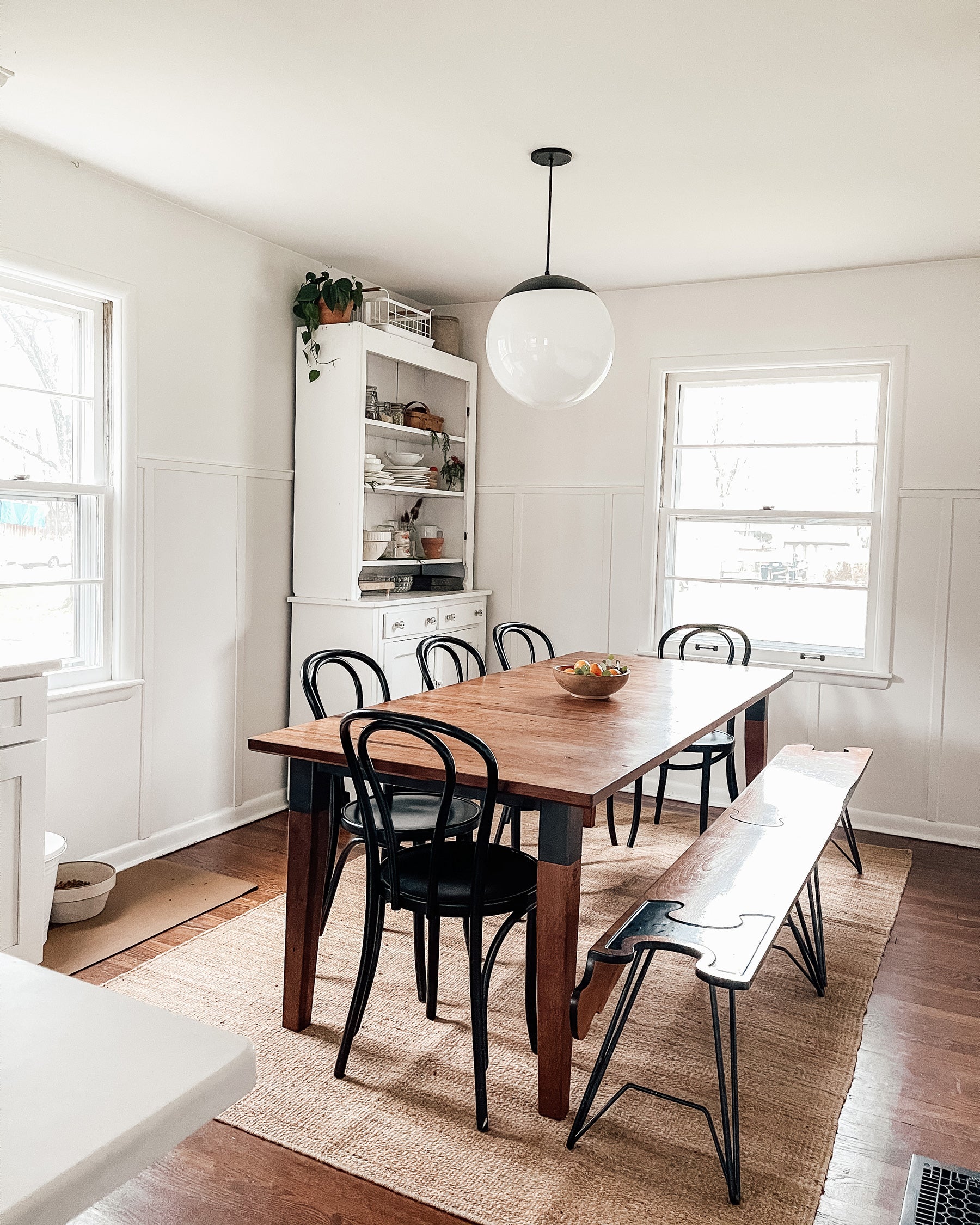 dining table and chairs and ceiling light fixture