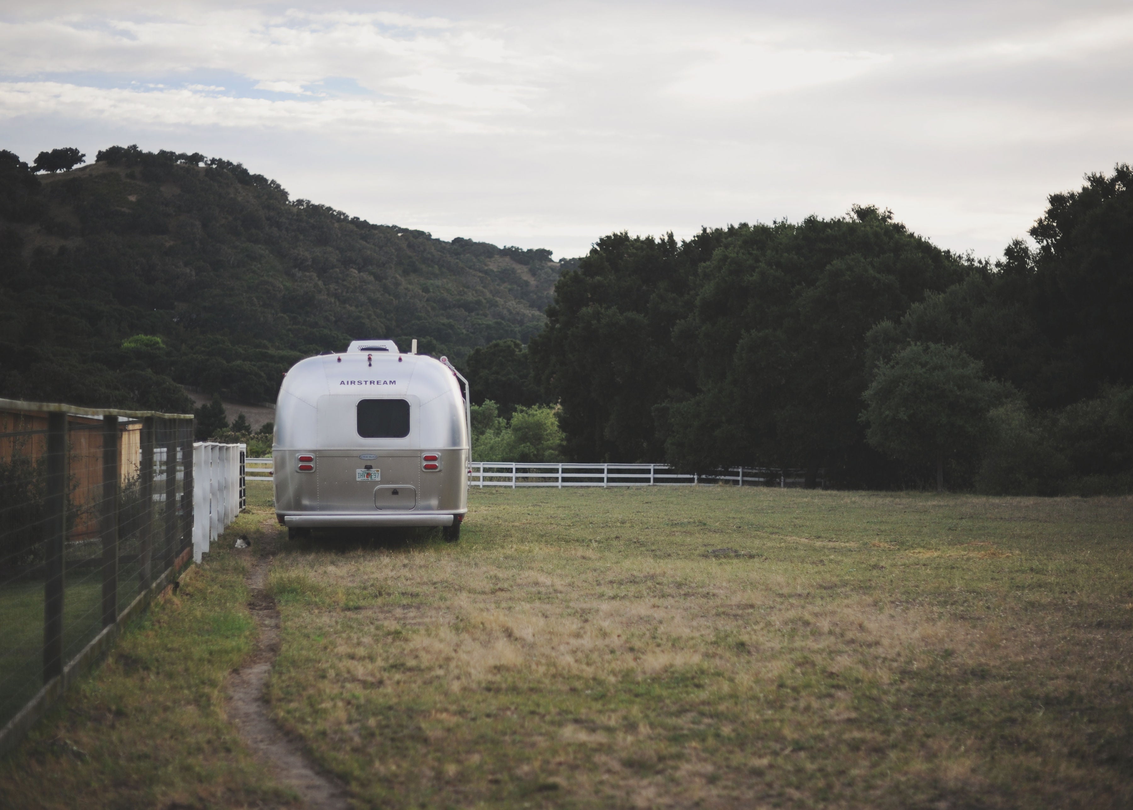 white van parked in a field