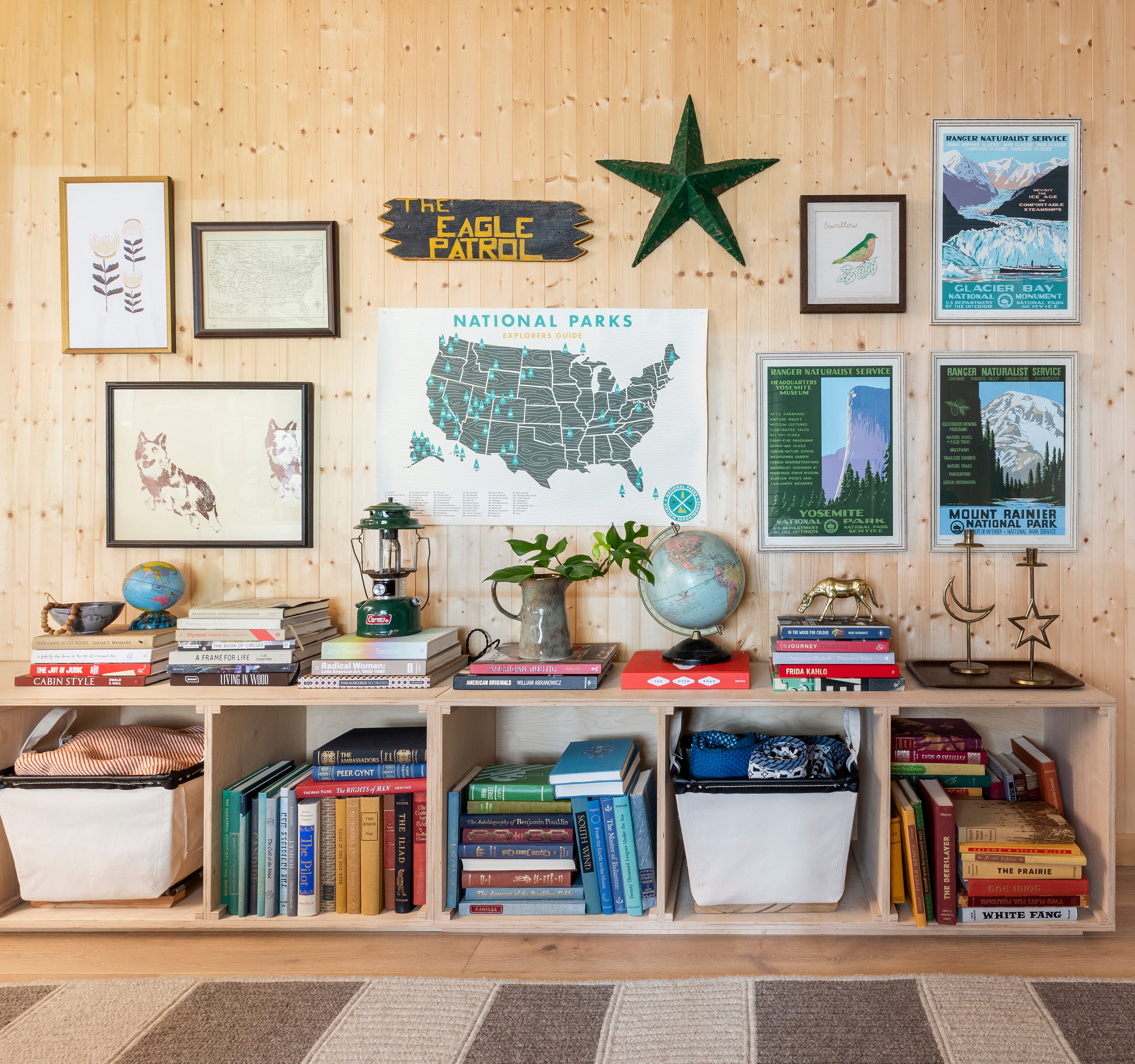 shelf with books and pictures on it