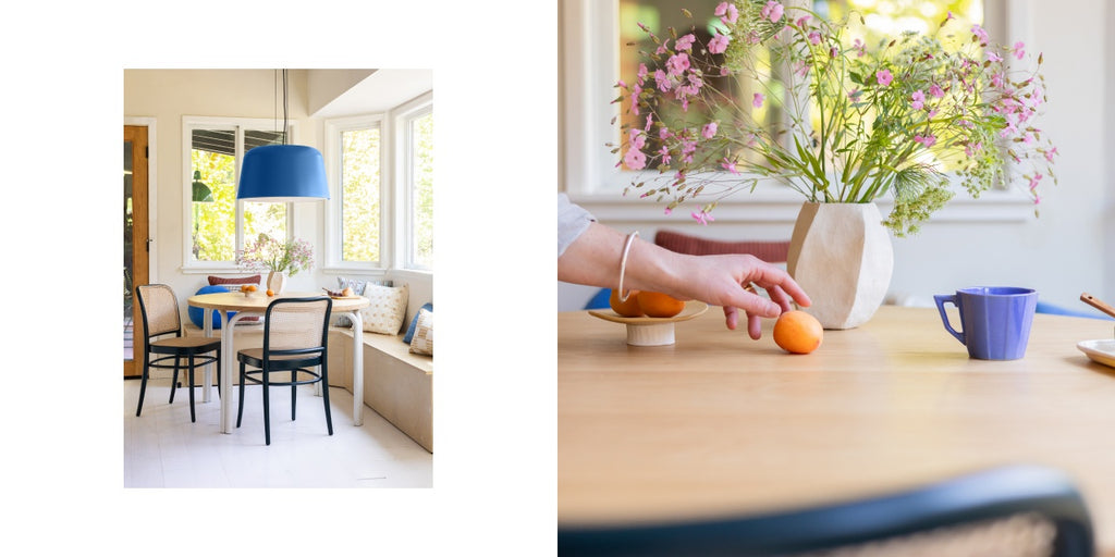 Kitchen table with Barnes Pendant, Forma Table,  Ton 811 Caned Chair (fern), Grid Stitch Pillow (blue)