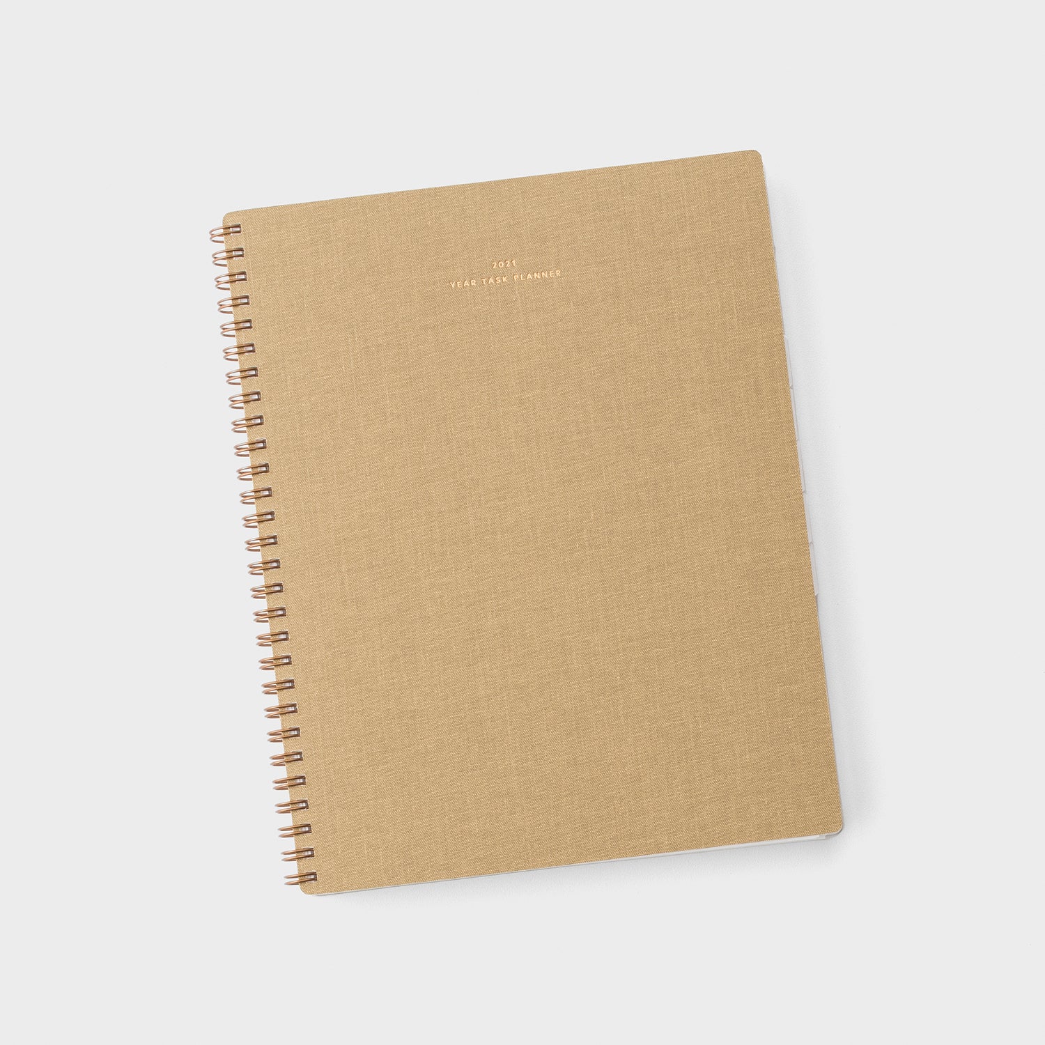 brown spiral-bound notebook