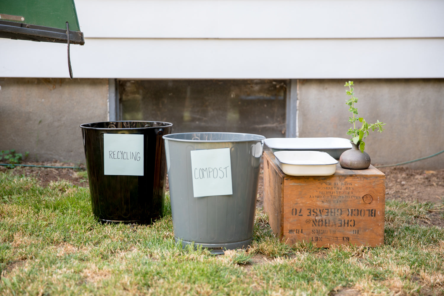 group of recycling and compost cans outside