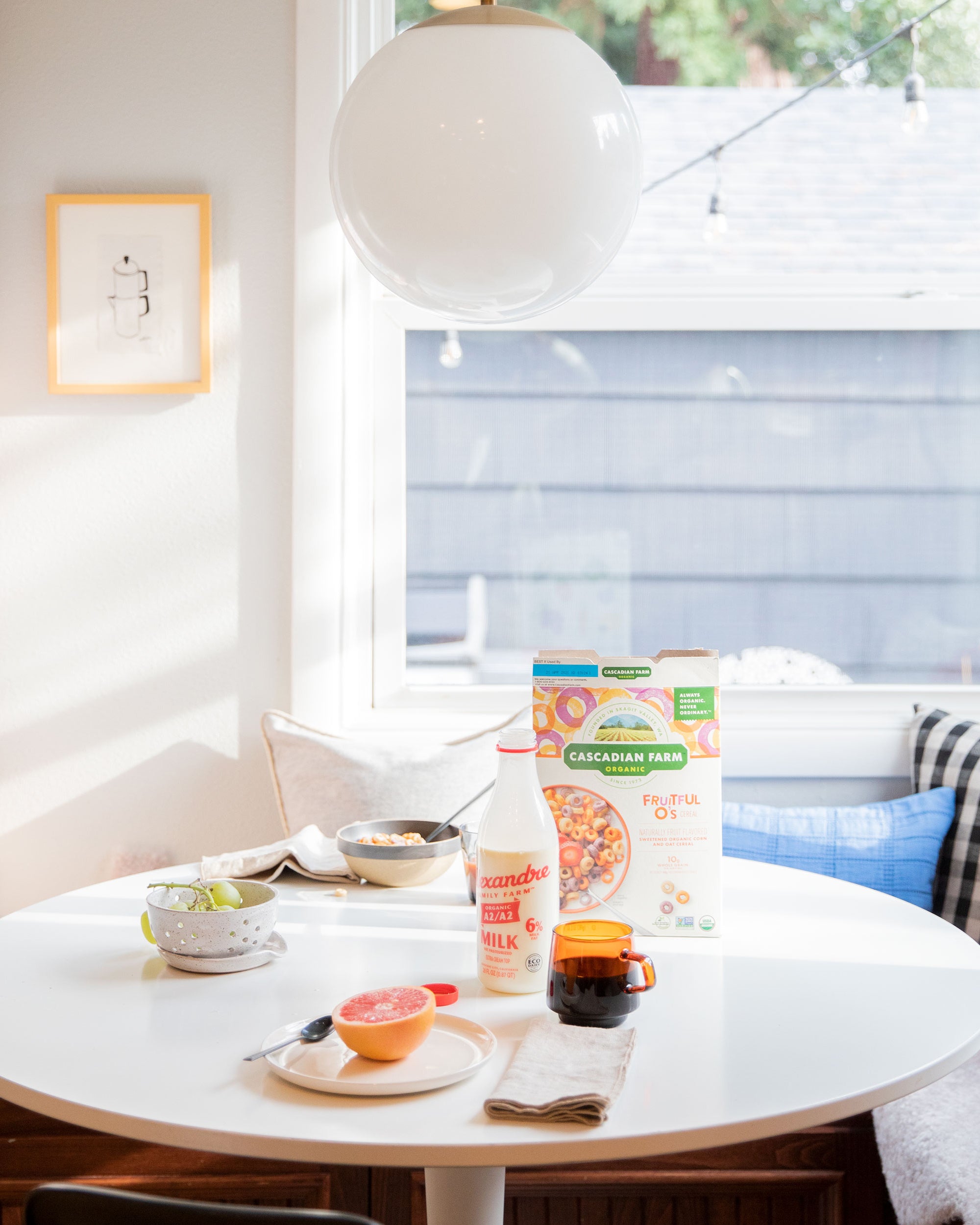 table with food and drinks on it and ceiling light fixture