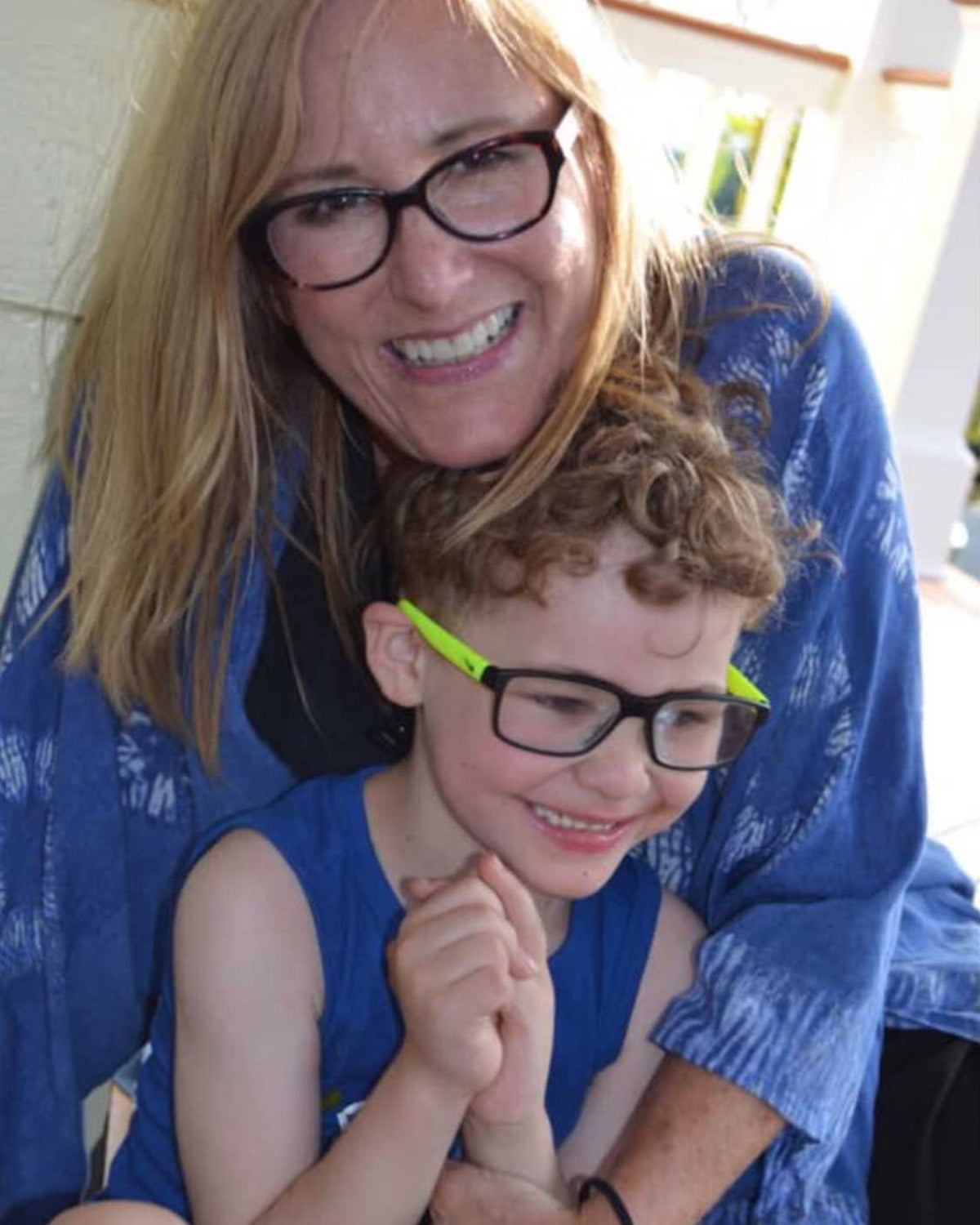 woman and a child posing for the camera