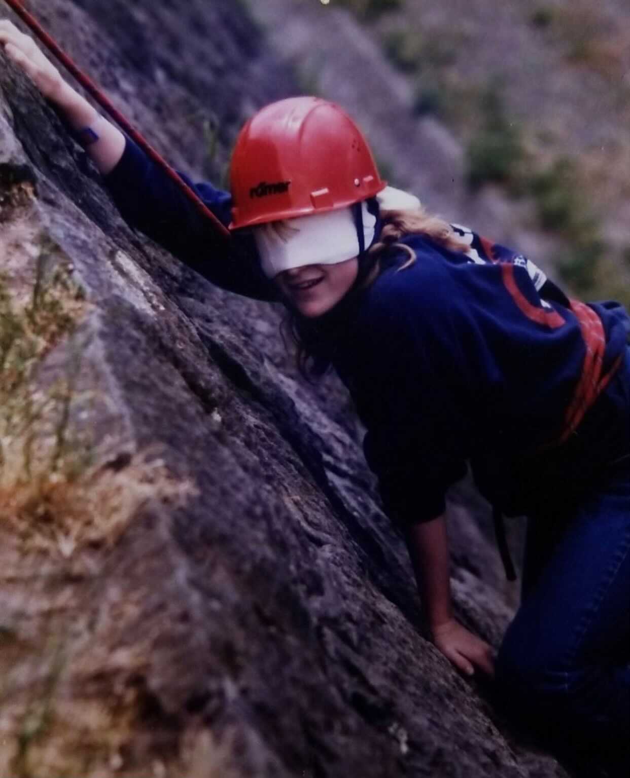 person climbing a rock
