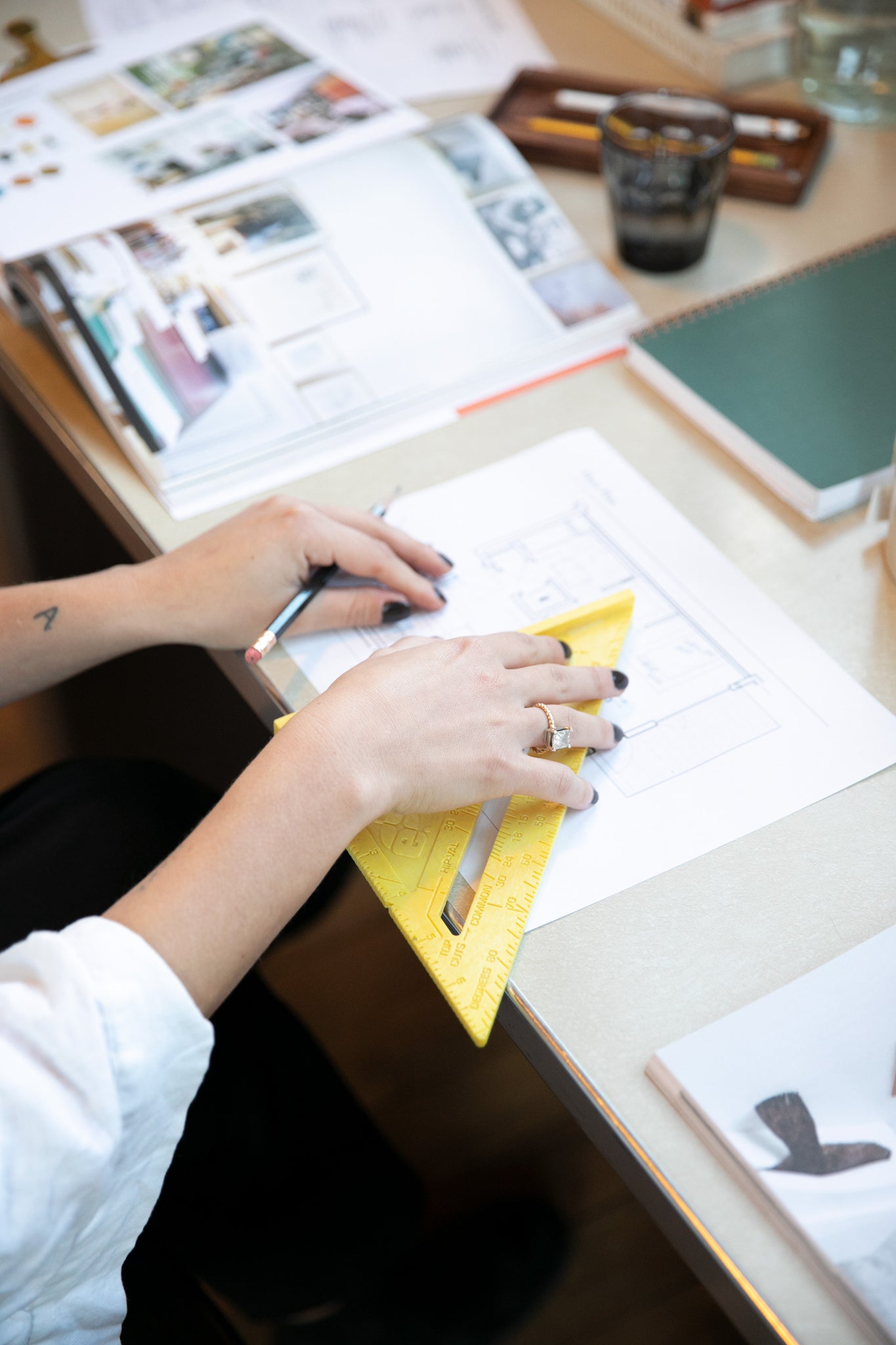 person writing on a piece of paper