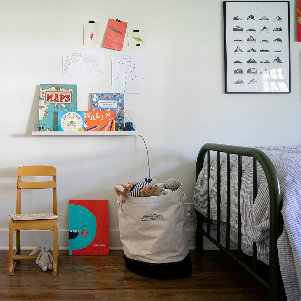 bed and bedframe and basket of toys