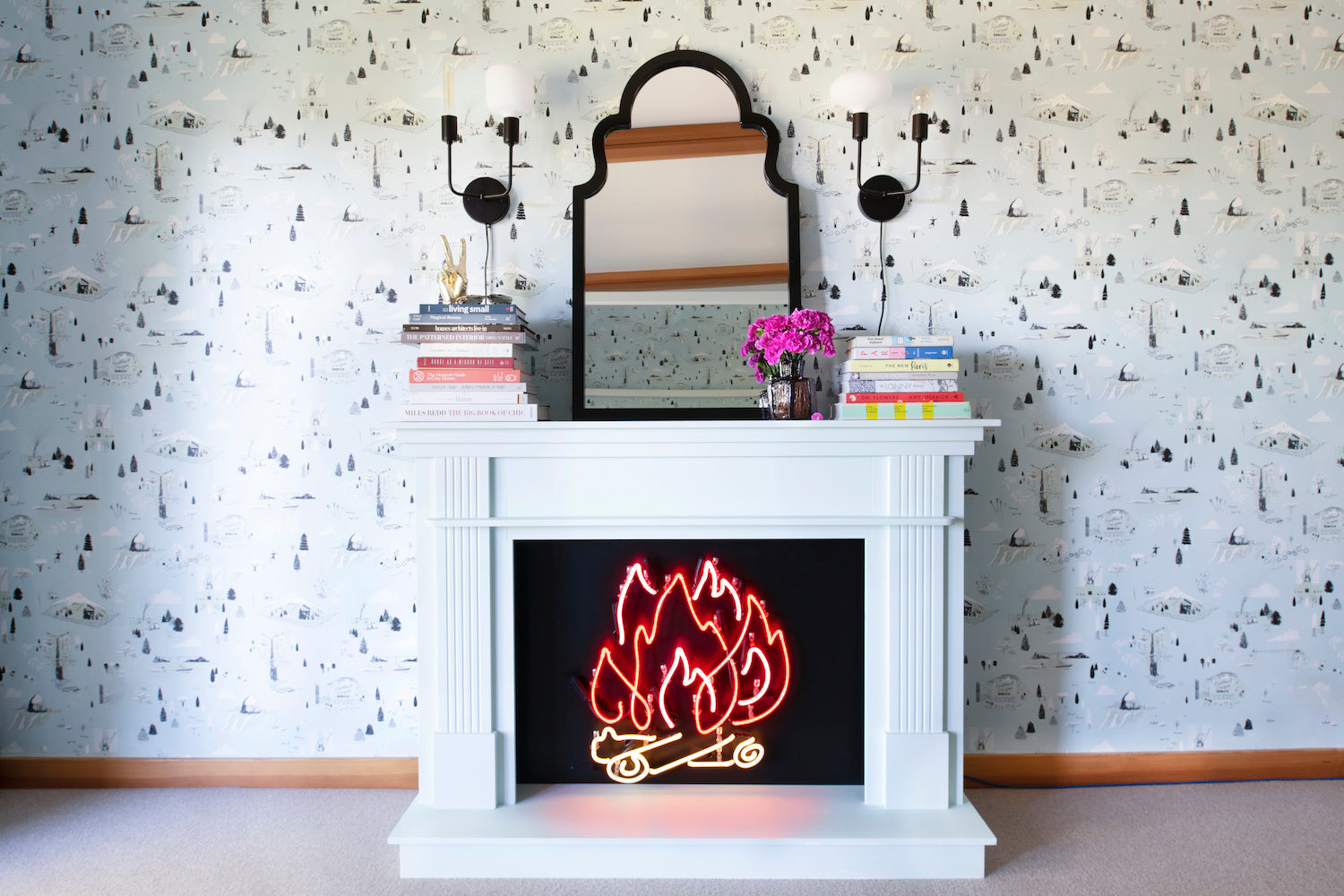 fireplace with a neon fire in it with a mirror on the mantle