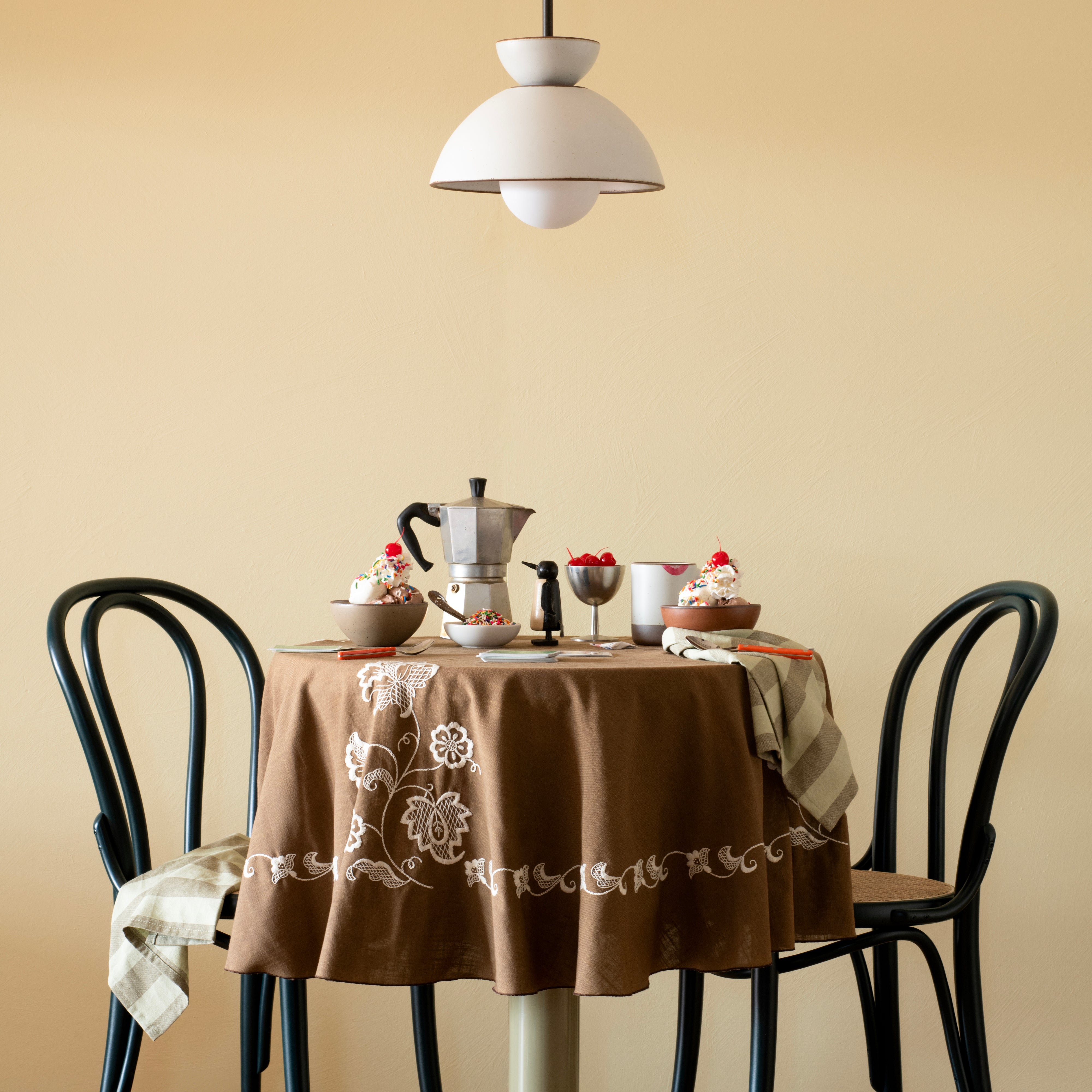 Schoolhouse East Fork pendant light over a table with ice cream