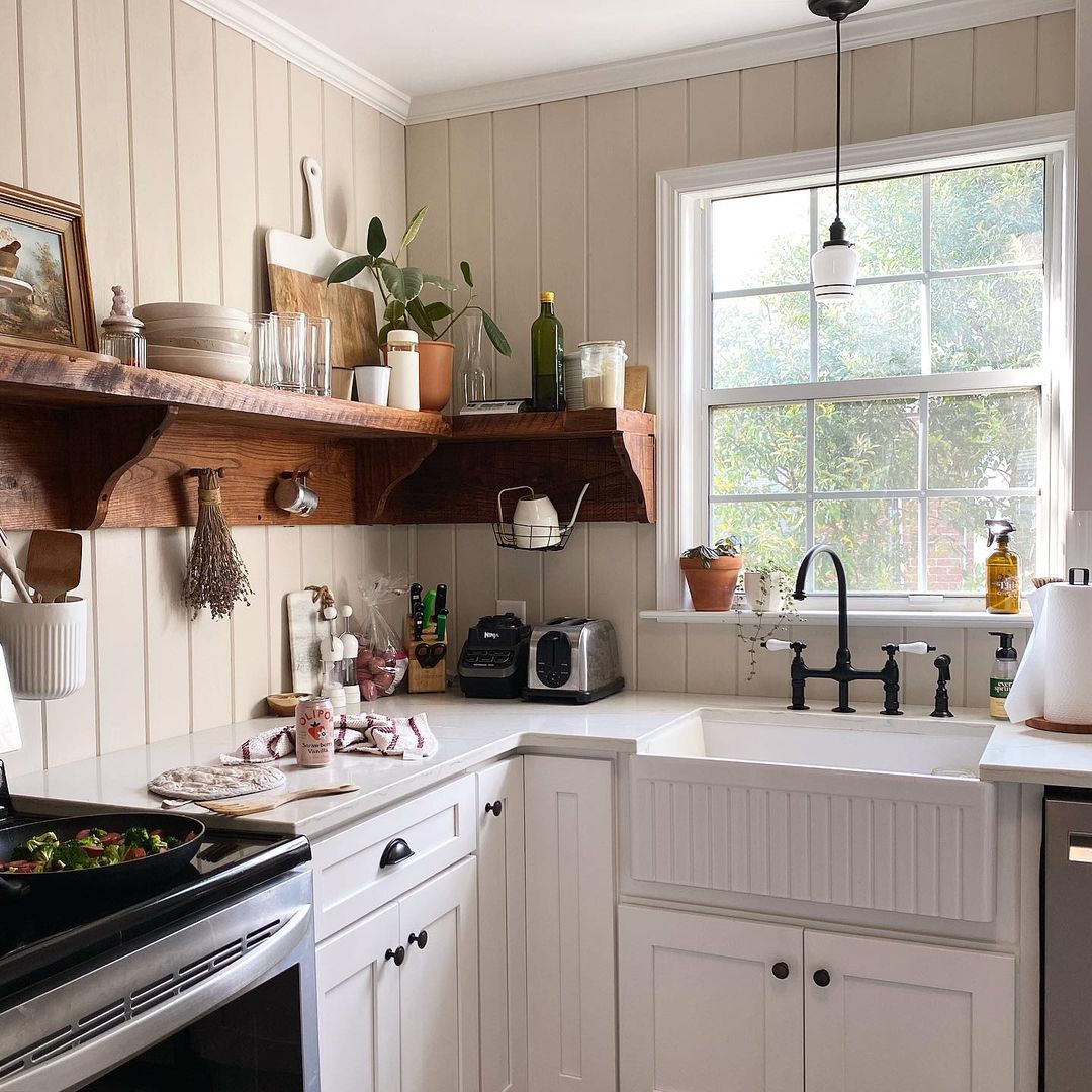 kitchen with white cabinets and brown open shelves