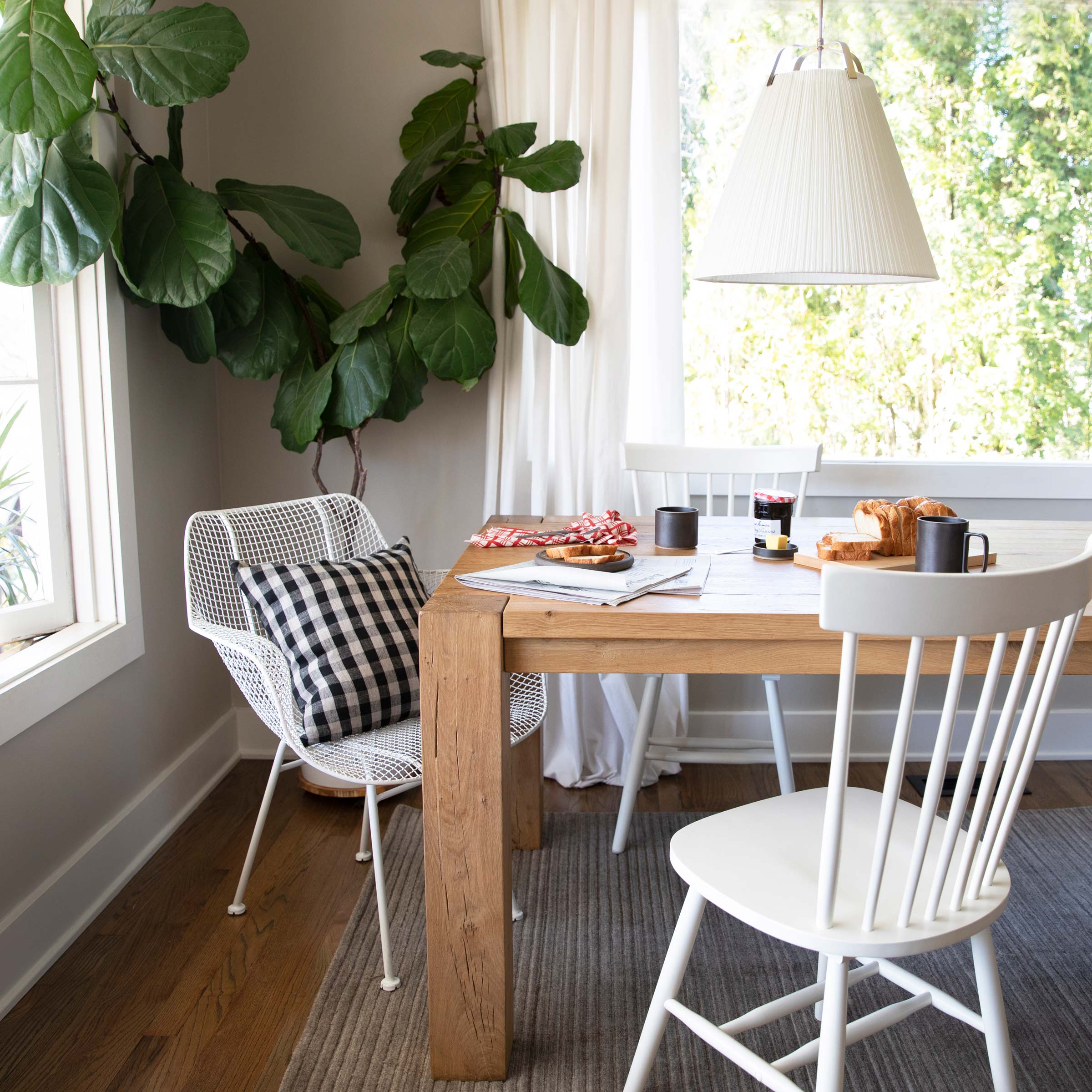 The Augustine Pendant light over a dining table. 