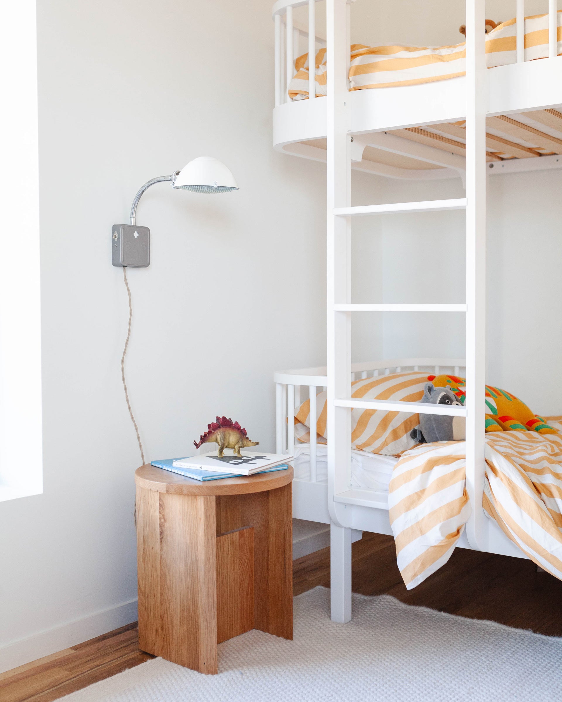 The Radar Sconce in white in a kid's room. 