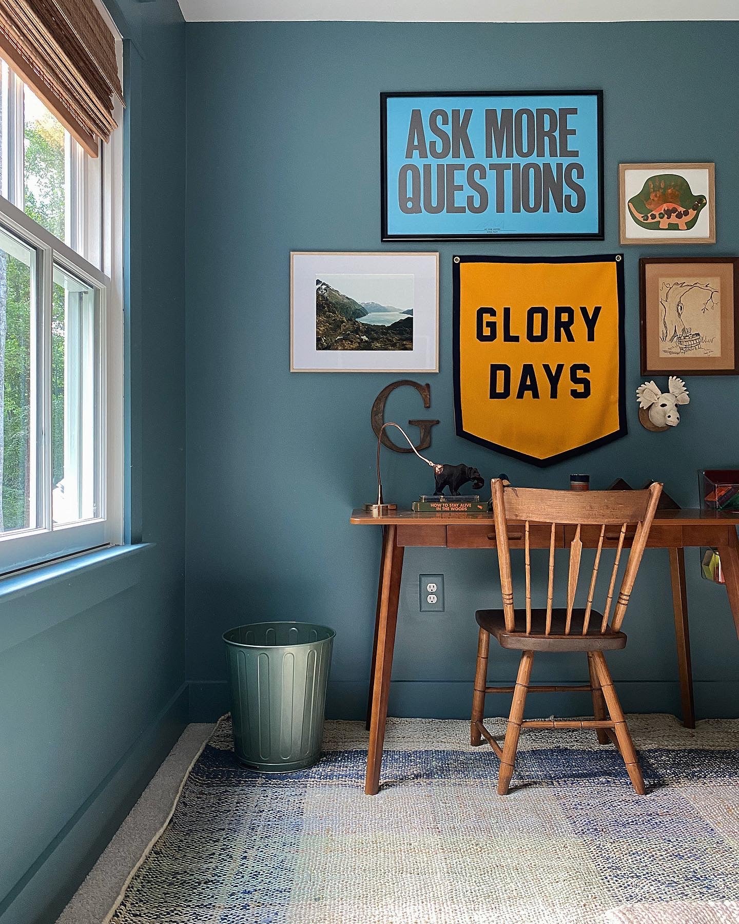 chair and a table in a room with art on wall