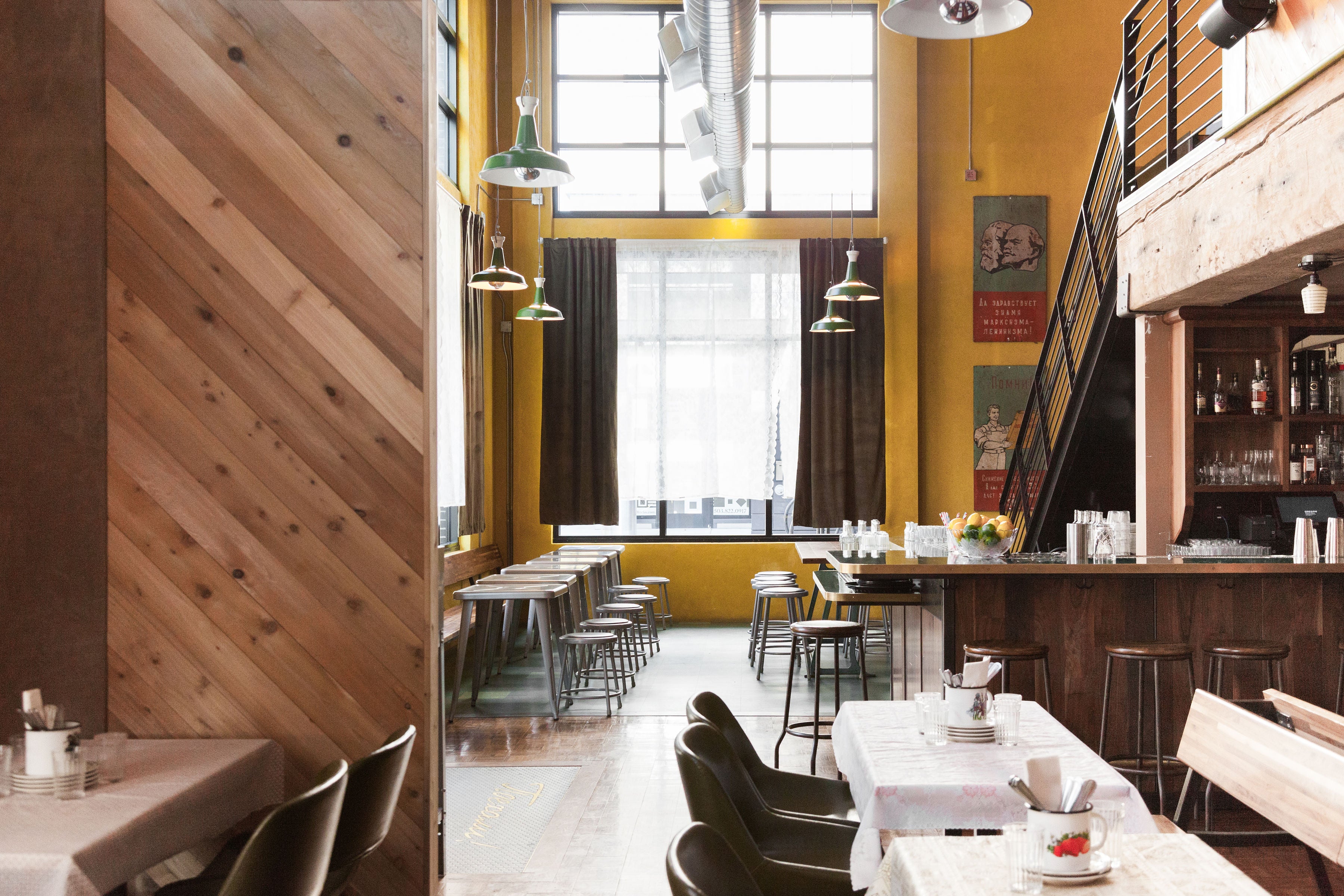 restaurant with tables and chairs and stairs