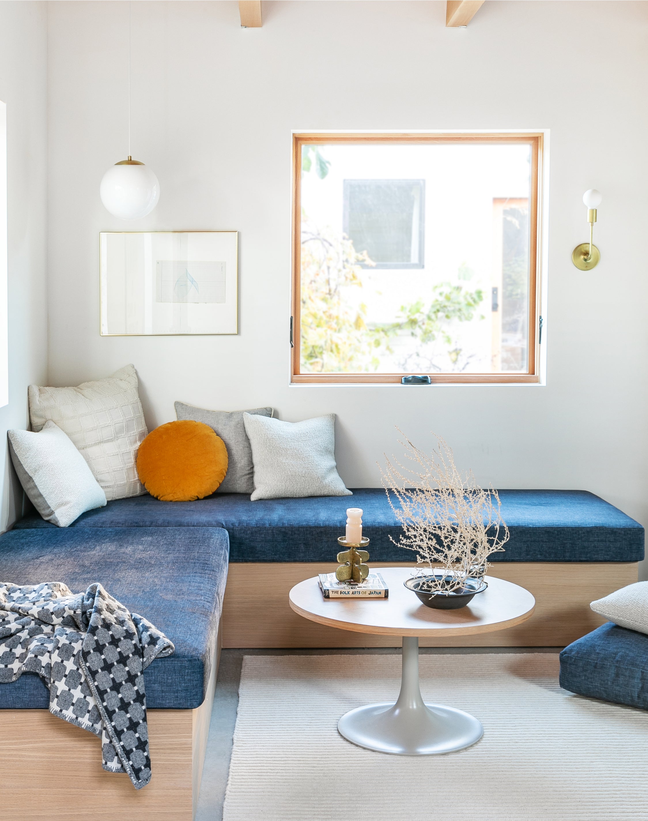 living room with a blue couch and a coffee table