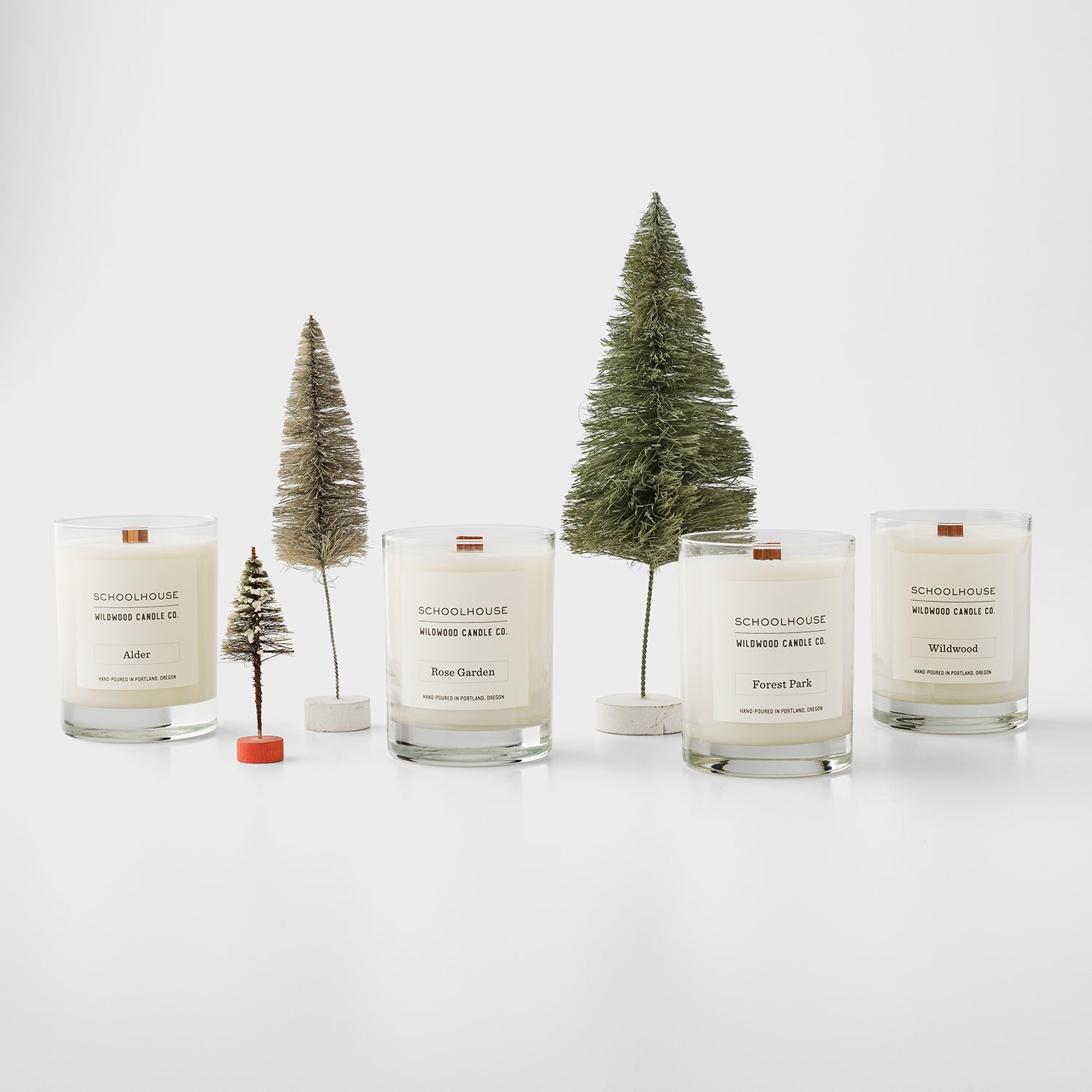 group of candles and miniature pine trees