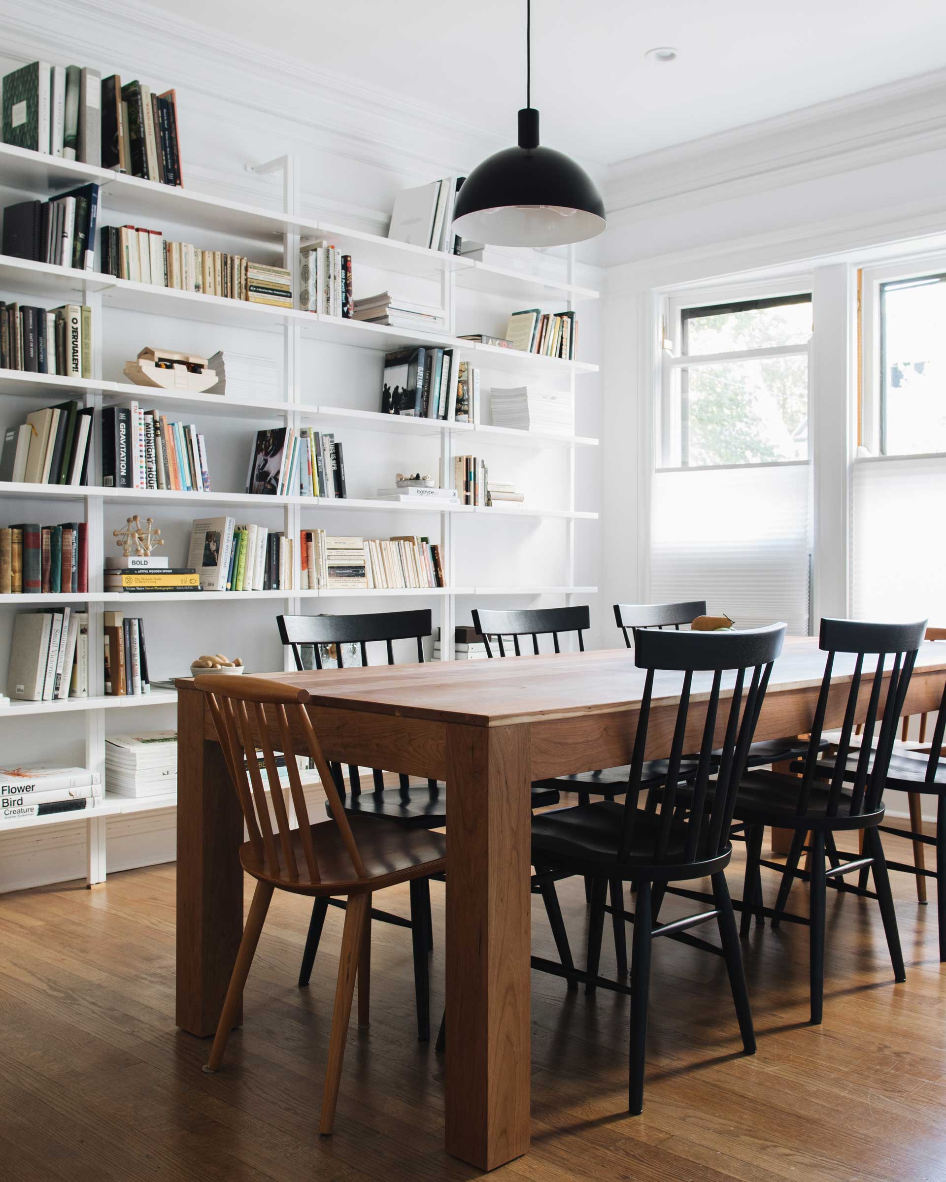 The Shelby Mod Pendant in black over a dining room table. 