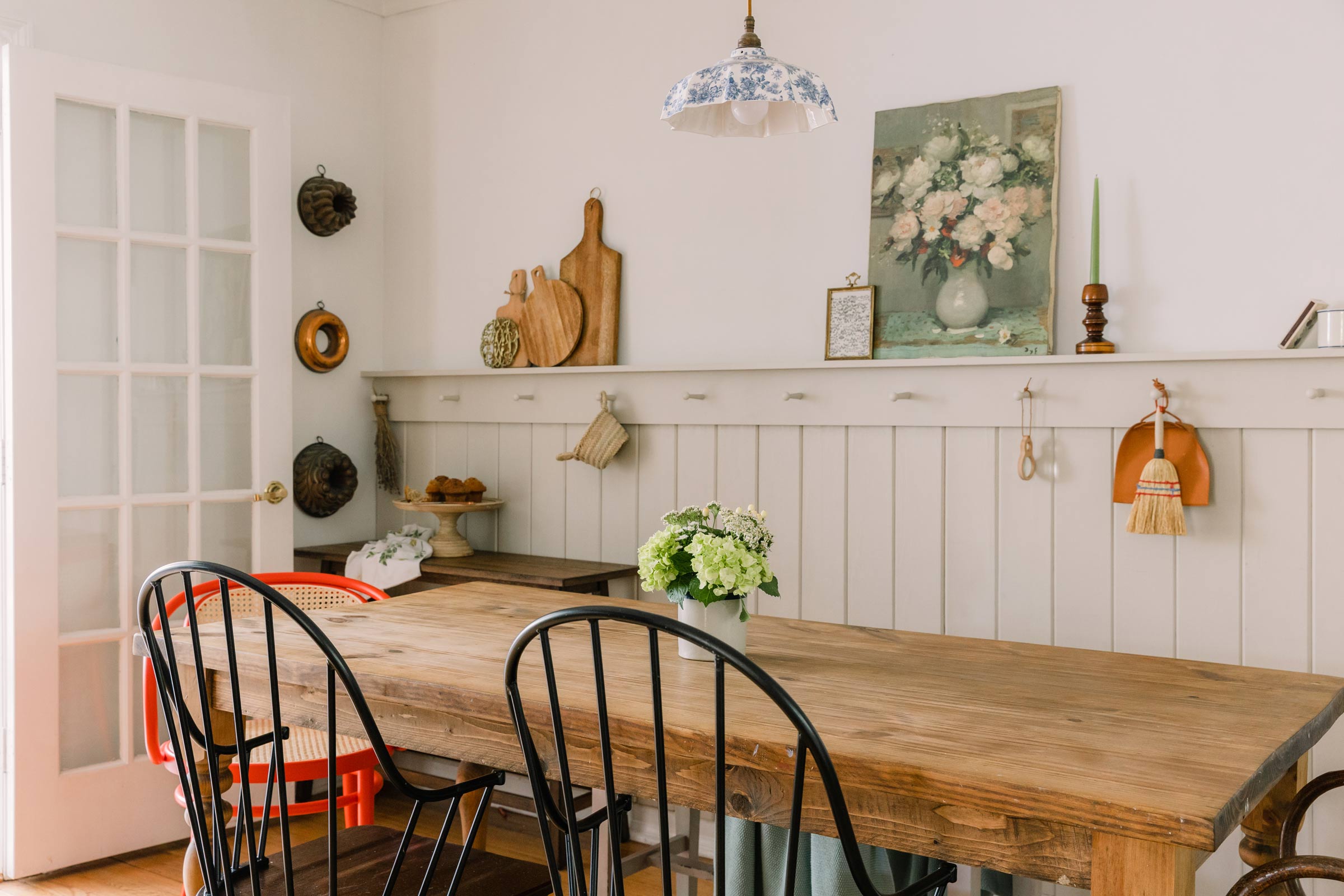 A dining table in a sunroom. 