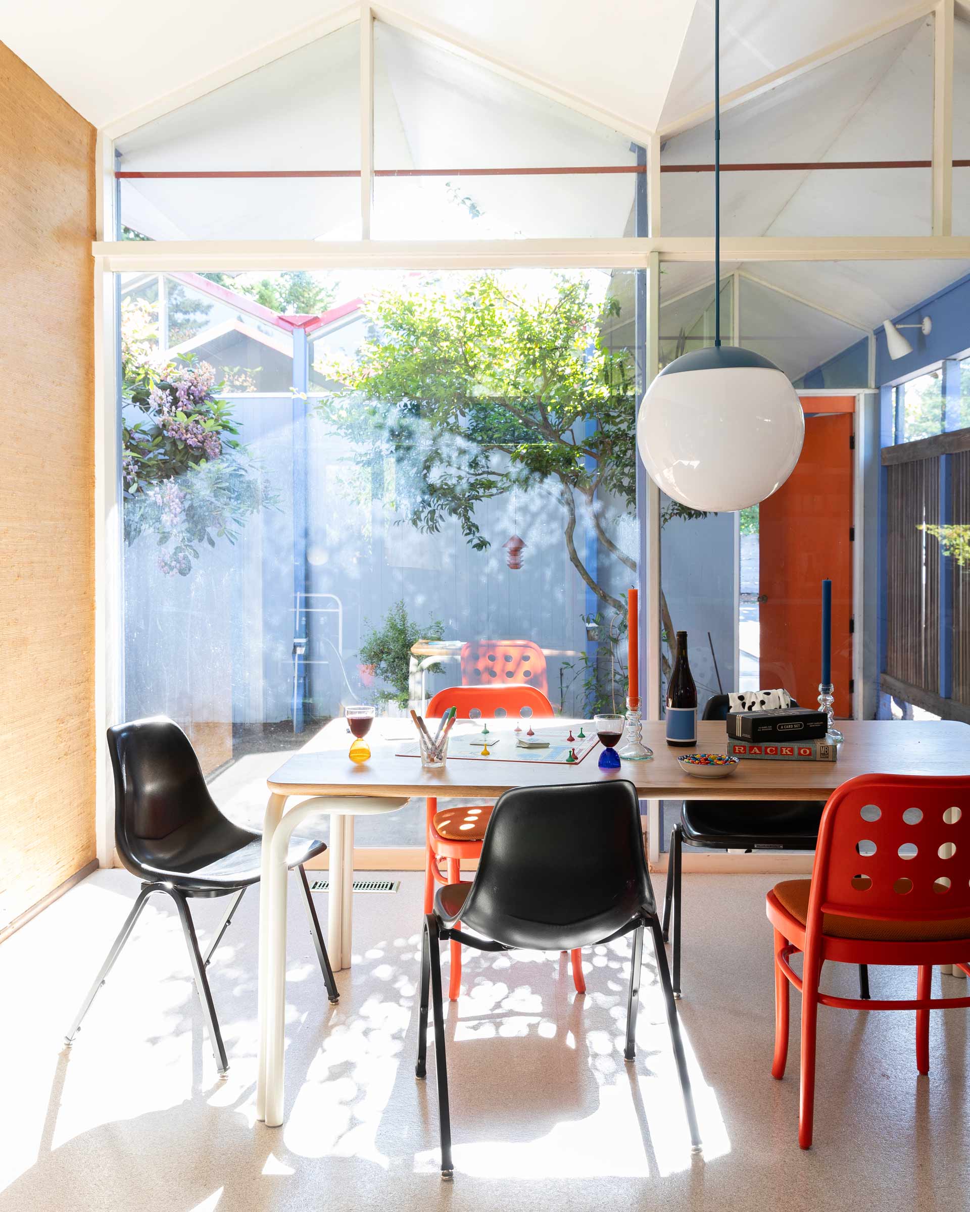 A Luna globe pendant over a dining room table.